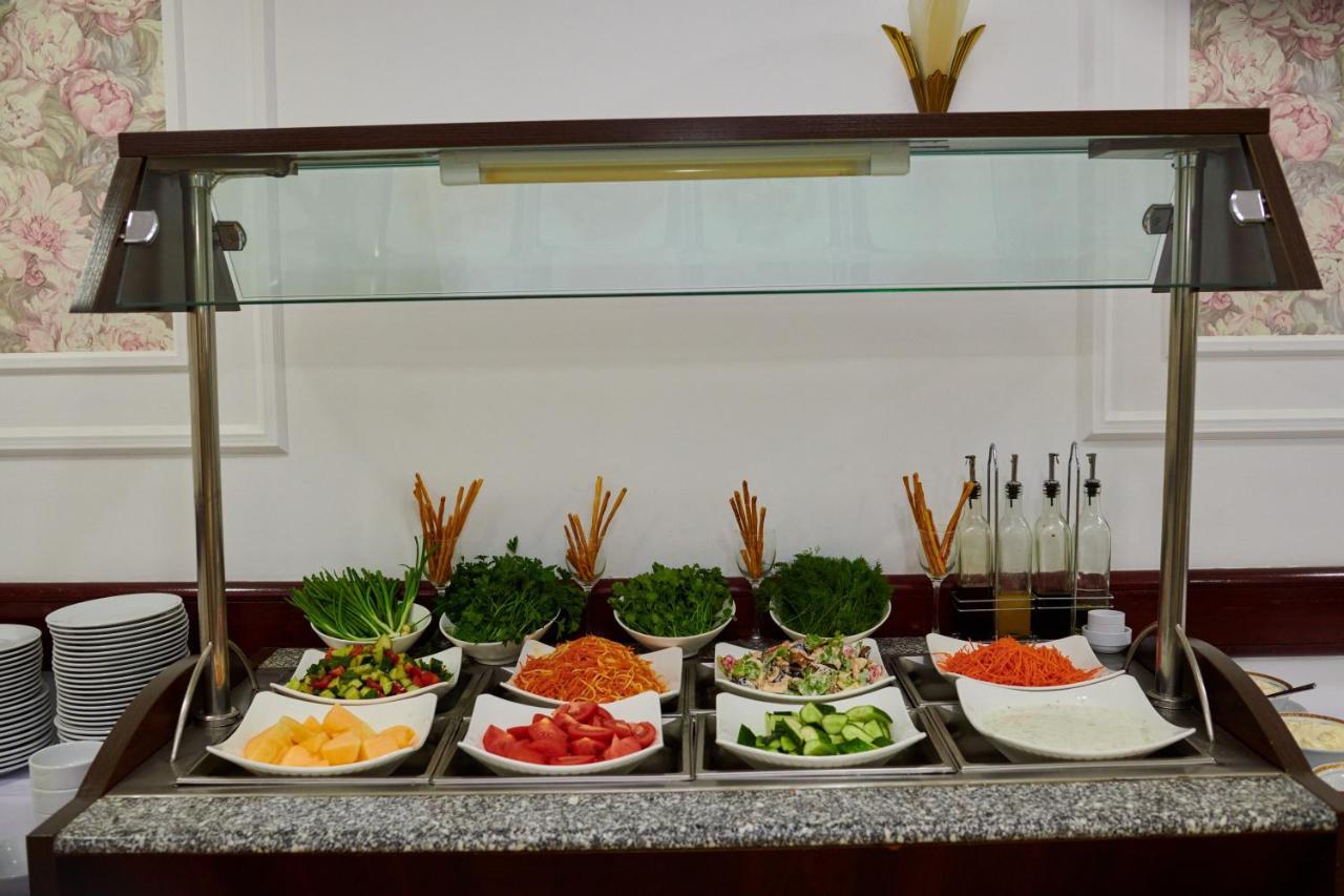 Grand Hotel Victory Aktau  Exterior photo A salad bar